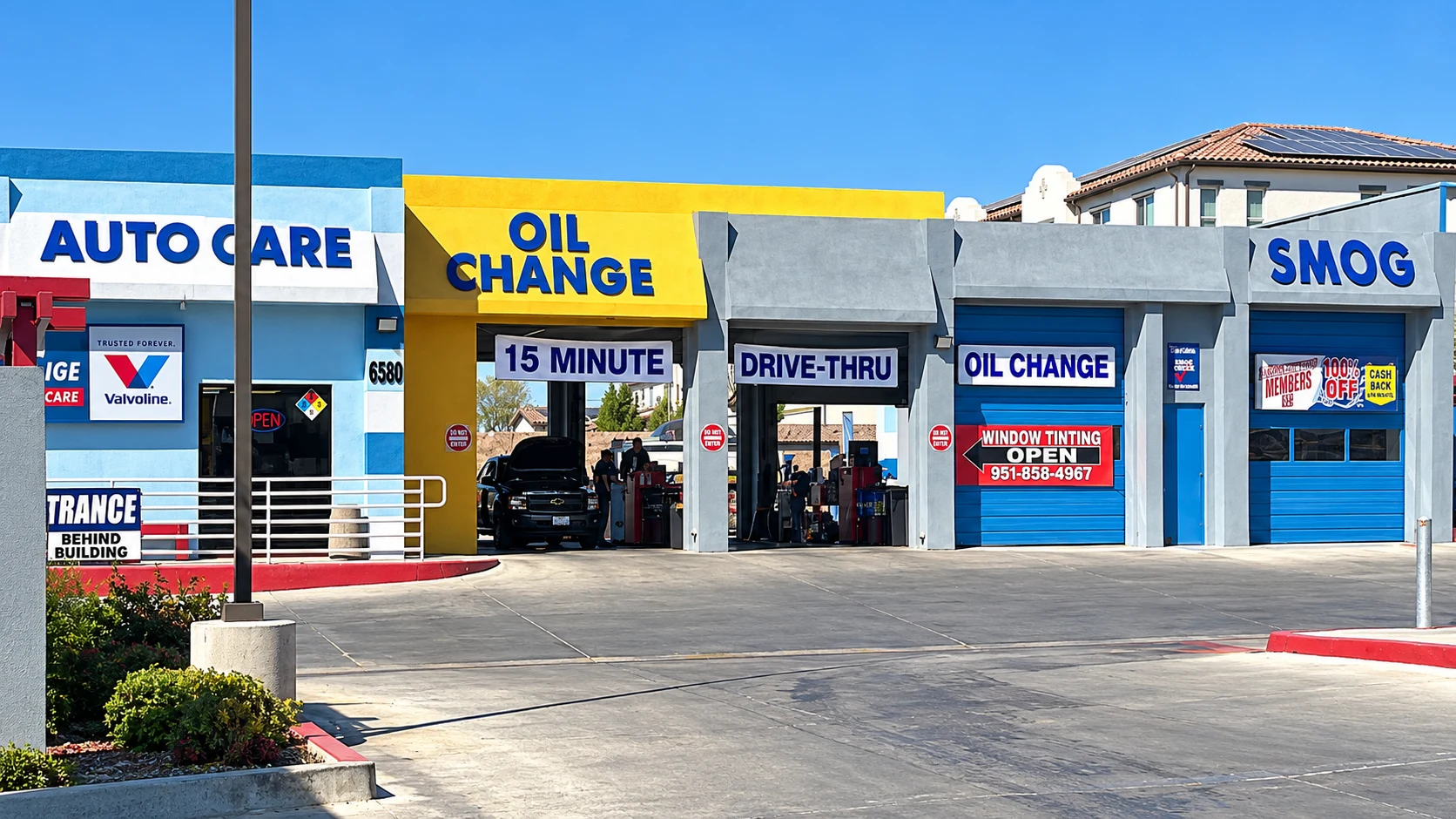 Highland Springs Automotive storefront with drive-through oil change bays and smog service signage